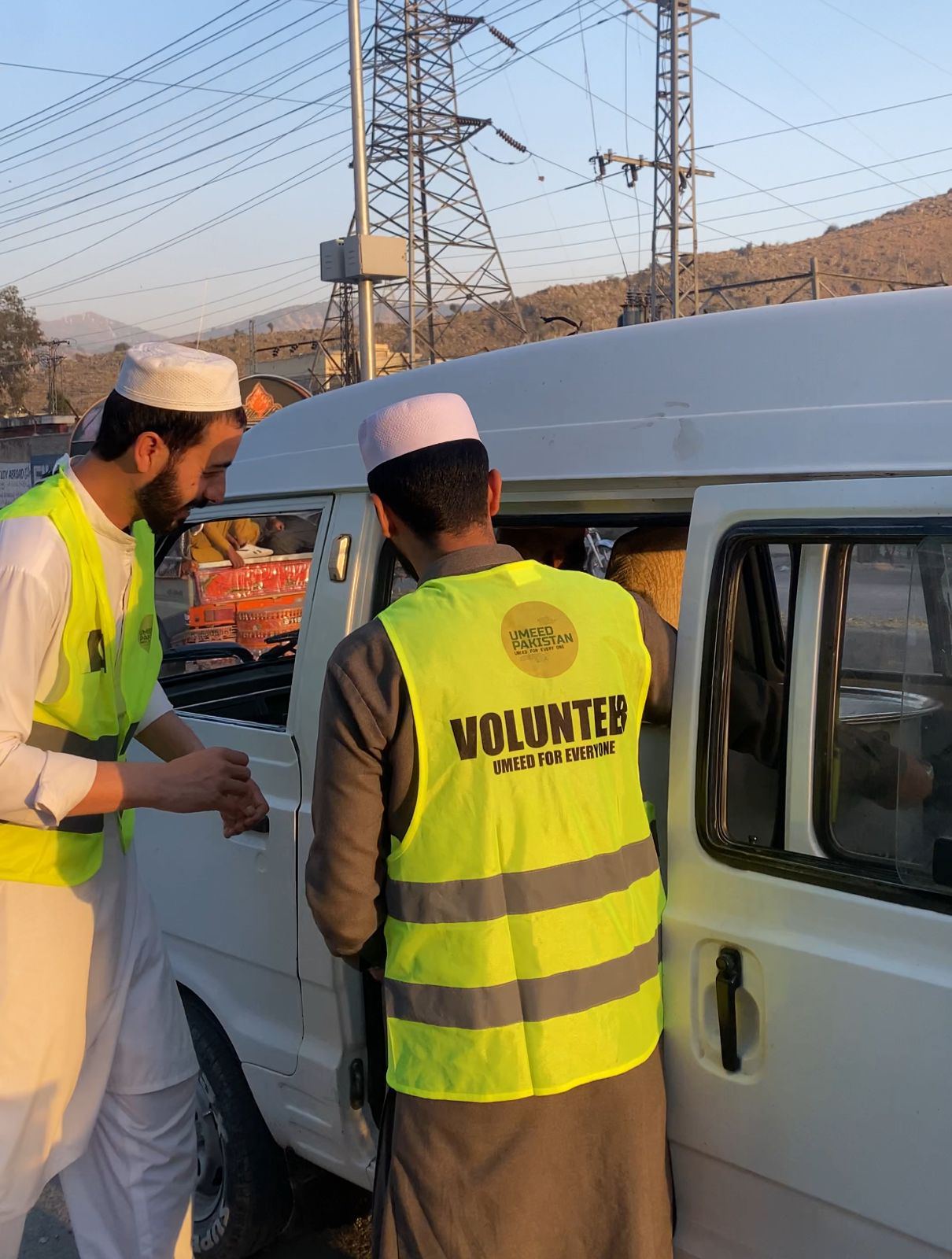 Volunteers collaborating at an Umeed Pakistan event